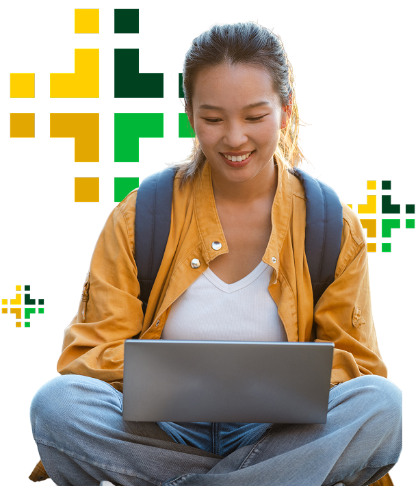 Young male teacher helping students in classroom